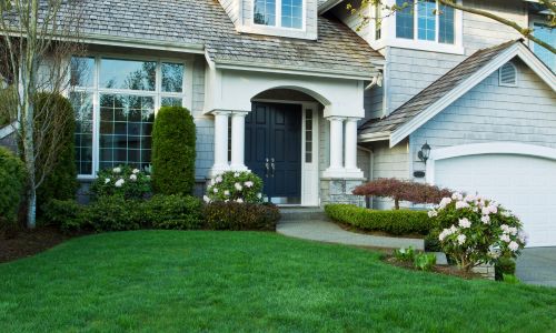 well maintained house with lush lawn